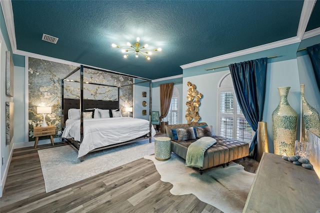 19620 Eagle Crest Dr, Lutz, FL 33549 - bedroom featuring a chandelier, ornamental molding, wood finished floors, a textured ceiling, and baseboards