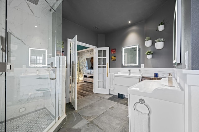 19620 Eagle Crest Dr, Lutz, FL 33549 - full bath with a marble finish shower, french doors, and vanity