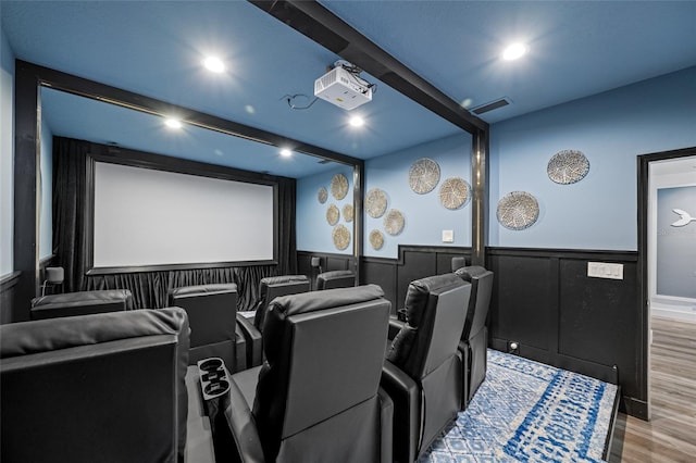 19620 Eagle Crest Dr, Lutz, FL 33549 - cinema room featuring a wainscoted wall, wood finished floors, and recessed lighting