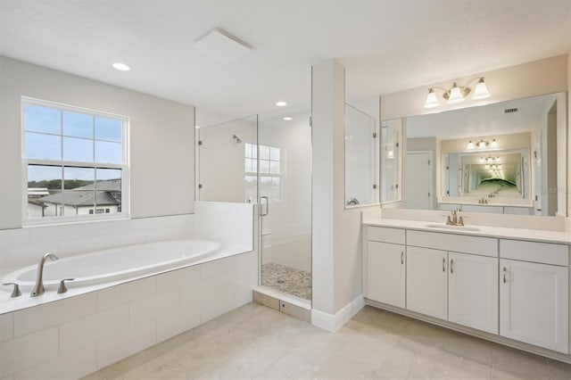 13137 Wellspring Dr, Lithia, FL 33547 - full bathroom featuring a garden tub, vanity, a shower stall, tile patterned flooring, and recessed lighting