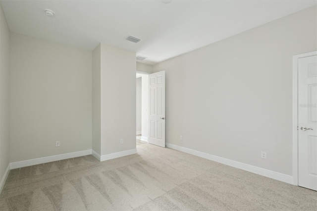 13137 Wellspring Dr, Lithia, FL 33547 - carpeted spare room featuring baseboards and a smoke detector