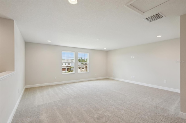 13137 Wellspring Dr, Lithia, FL 33547 - unfurnished room featuring carpet flooring, recessed lighting, and attic access