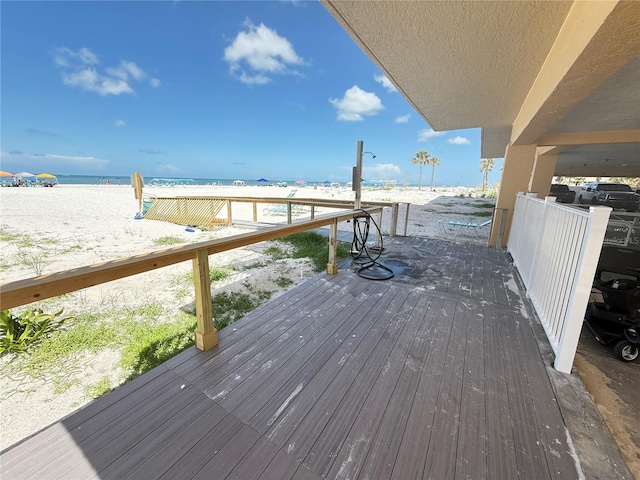 13440 Gulf Blvd Unit 501, Madeira Beach, FL 33708 - wooden deck featuring view of water and beach