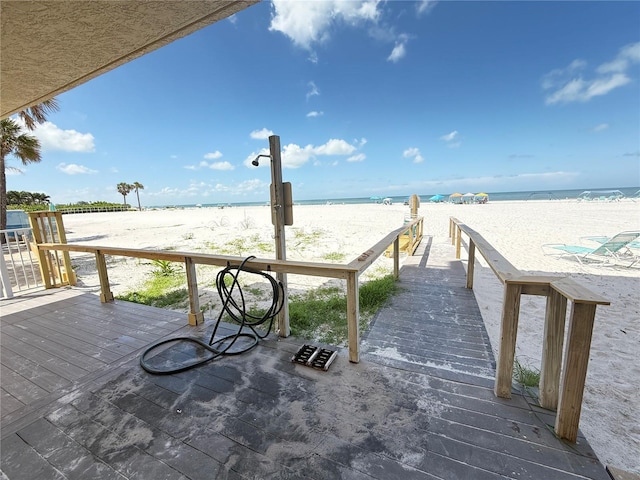 13440 Gulf Blvd Unit 501, Madeira Beach, FL 33708 - wooden terrace with view of water and beach