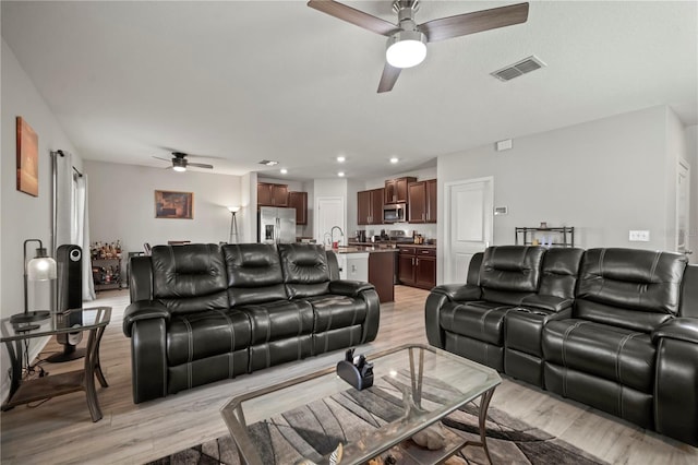 9640 Lemon Drop Loop, Ruskin, FL 33573 - living room featuring a ceiling fan, light wood-type flooring, and recessed lighting