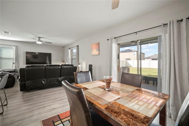 9640 Lemon Drop Loop, Ruskin, FL 33573 - dining area featuring a ceiling fan and light wood-style flooring