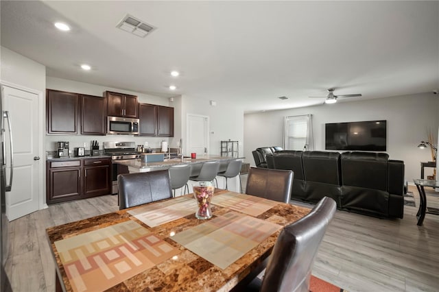 9640 Lemon Drop Loop, Ruskin, FL 33573 - dining area featuring light wood-style flooring, ceiling fan, and recessed lighting