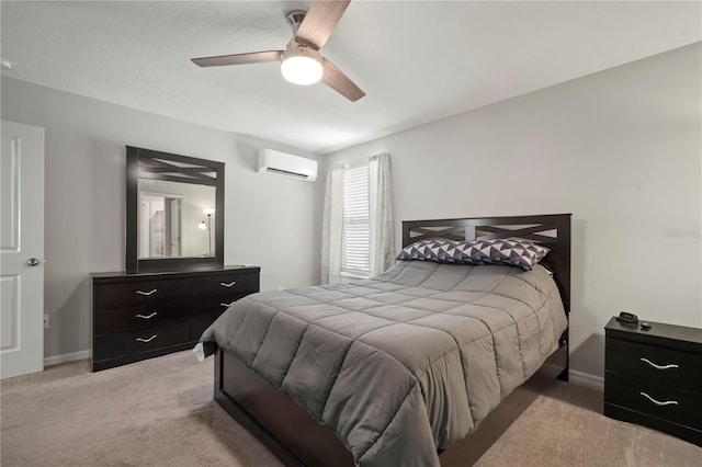 9640 Lemon Drop Loop, Ruskin, FL 33573 - bedroom featuring a wall mounted AC, light carpet, ceiling fan, and baseboards