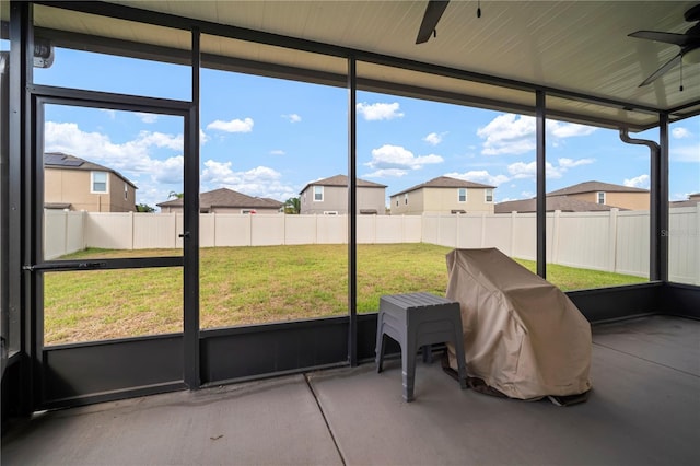 9640 Lemon Drop Loop, Ruskin, FL 33573 - sunroom / solarium with ceiling fan, a residential view, and healthy amount of natural light