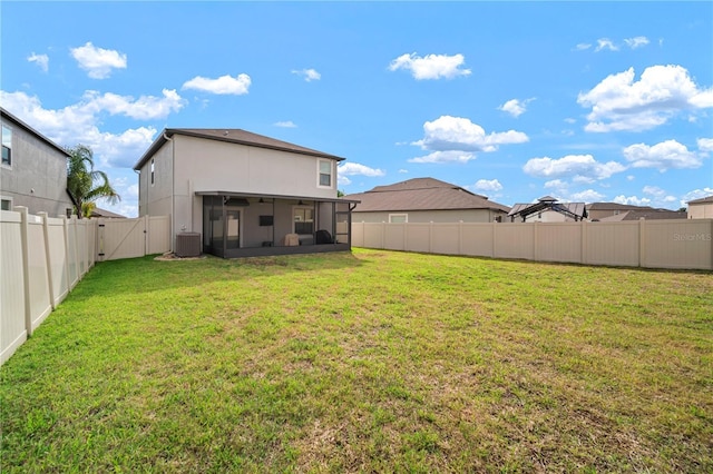 9640 Lemon Drop Loop, Ruskin, FL 33573 - view of yard featuring a sunroom, a gate, and central AC