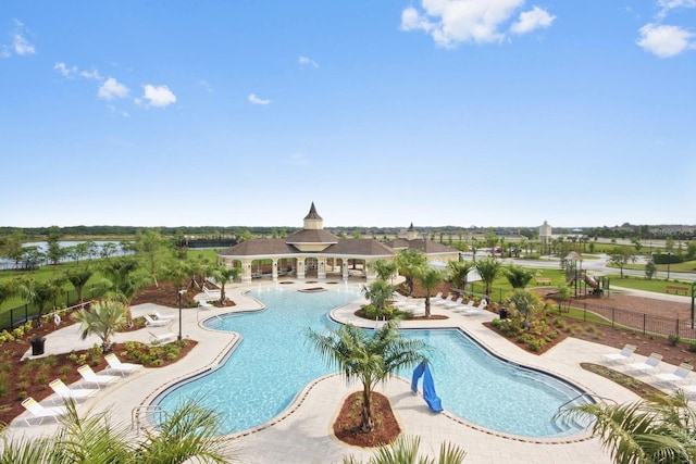 9640 Lemon Drop Loop, Ruskin, FL 33573 - community pool featuring fence and a patio