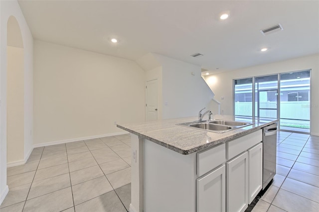 2882 Peony Prairie Ln, Wesley Chapel, FL 33543 - kitchen with light tile patterned floors, a kitchen island with sink, white cabinets, recessed lighting, and stainless steel dishwasher