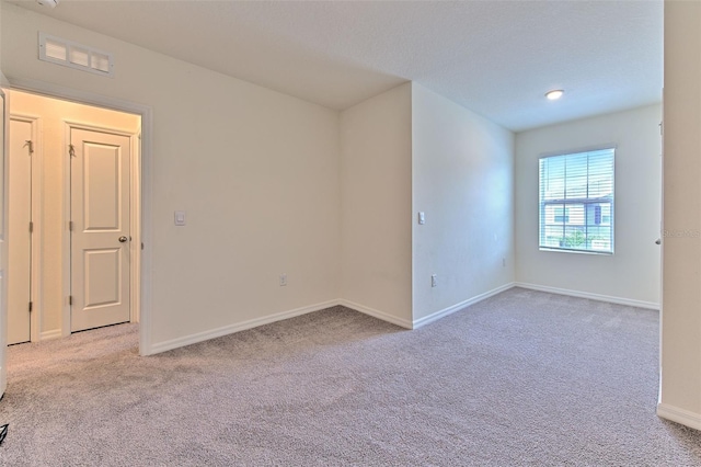 2882 Peony Prairie Ln, Wesley Chapel, FL 33543 - spare room with light carpet and baseboards