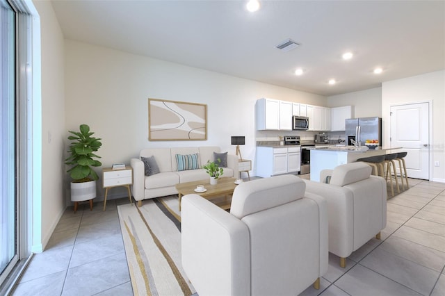 2882 Peony Prairie Ln, Wesley Chapel, FL 33543 - living area with light tile patterned floors and recessed lighting