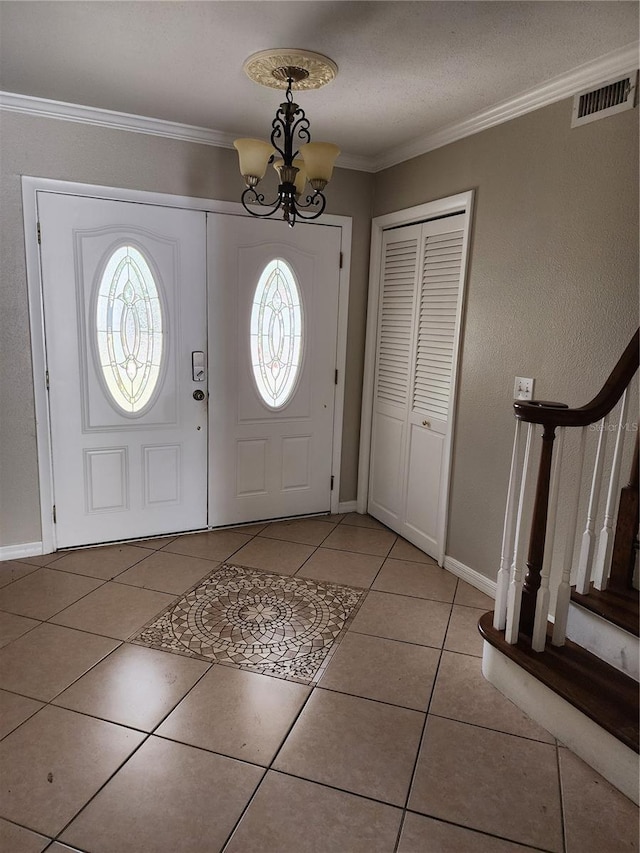 6906 Shady Pl, Tampa, FL 33634 - foyer entrance with plenty of natural light, a chandelier, crown molding, light tile patterned floors, and stairs