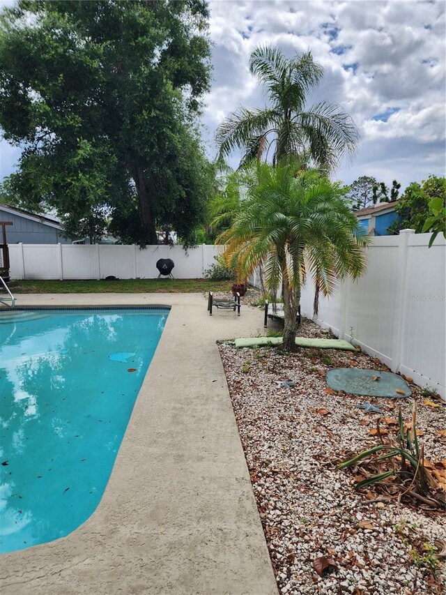 6906 Shady Pl, Tampa, FL 33634 - view of swimming pool with a fenced backyard