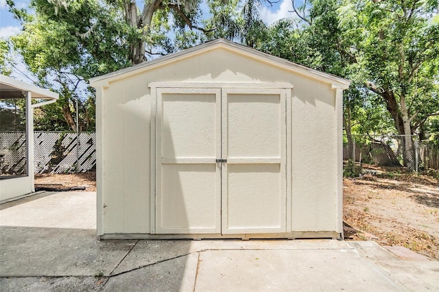 1225 15th St, Palm Harbor, FL 34683 - view of shed with a fenced backyard