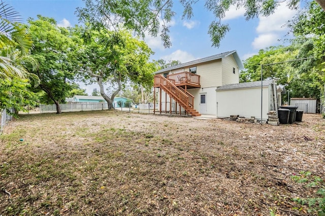 1225 15th St, Palm Harbor, FL 34683 - rear view of house featuring stairway, a deck, and a fenced backyard
