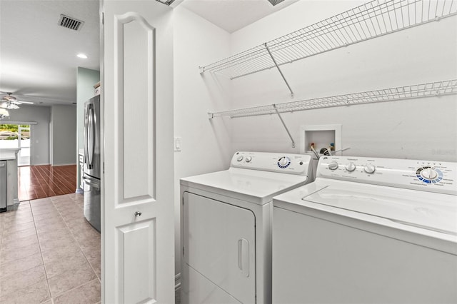 laundry area with washing machine and clothes dryer, ceiling fan, light tile patterned flooring, and recessed lighting