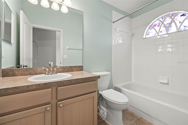 bathroom with toilet, vanity, tub / shower combination, and tile patterned flooring