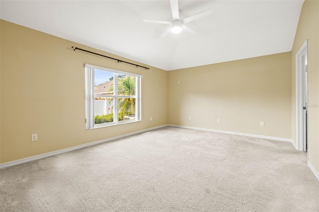 unfurnished room with light carpet, baseboards, ceiling fan, and lofted ceiling