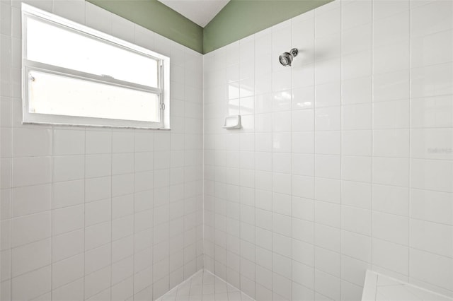 bathroom with tiled shower