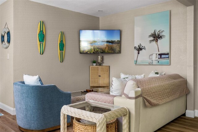 616 11th St NW, Largo, FL 33770 - living room featuring wood finished floors and baseboards