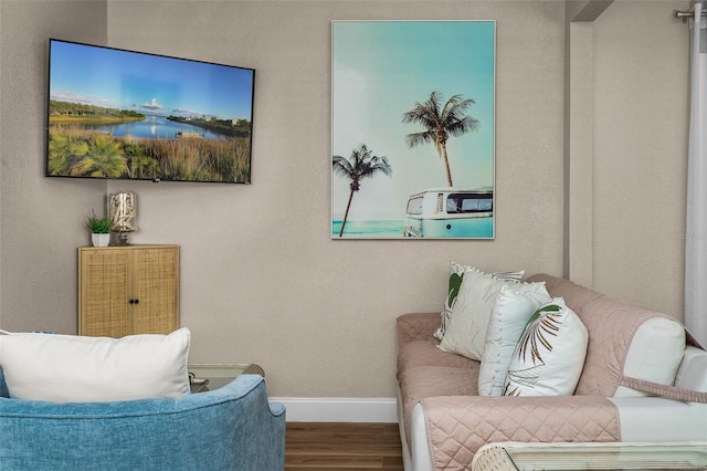 616 11th St NW, Largo, FL 33770 - living area featuring wood finished floors and baseboards