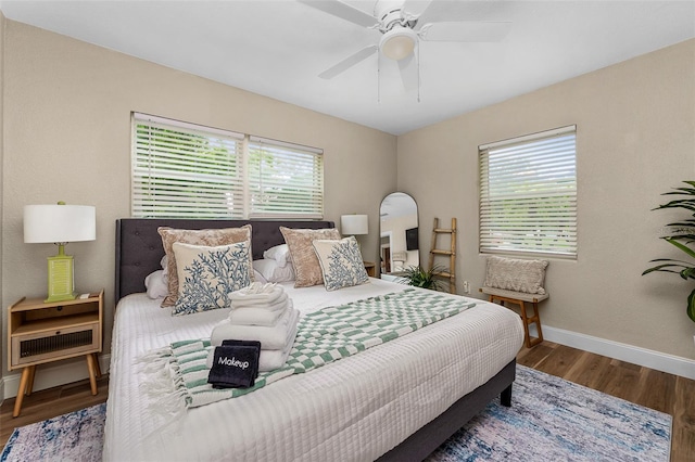 616 11th St NW, Largo, FL 33770 - bedroom with baseboards, wood finished floors, and ceiling fan