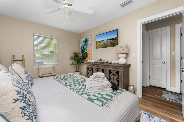 616 11th St NW, Largo, FL 33770 - bedroom featuring wood finished floors and ceiling fan