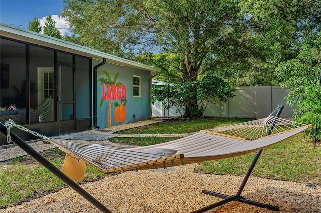 616 11th St NW, Largo, FL 33770 - view of yard with fence and a sunroom