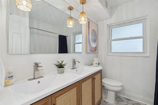full bathroom featuring toilet, double vanity, baseboards, a shower with shower curtain, and tile patterned flooring