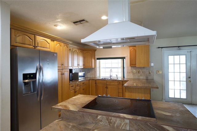 8209 Chaucer Dr, Weeki Wachee, FL 34607 - kitchen with stainless steel appliances, island exhaust hood, backsplash, and recessed lighting