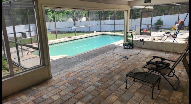 8209 Chaucer Dr, Weeki Wachee, FL 34607 - view of swimming pool featuring a patio, a fenced backyard, and glass enclosure