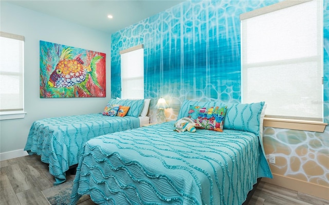 4620 Oro Pesos Ln, Captiva, FL 33924 - bedroom featuring baseboards, wood finished floors, and recessed lighting