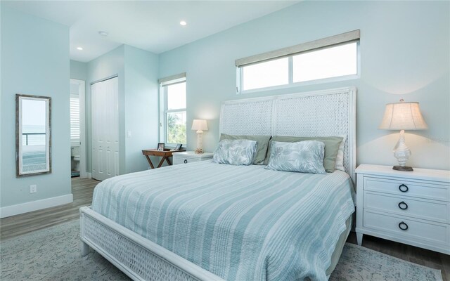 4620 Oro Pesos Ln, Captiva, FL 33924 - bedroom featuring wood finished floors, baseboards, a closet, and recessed lighting