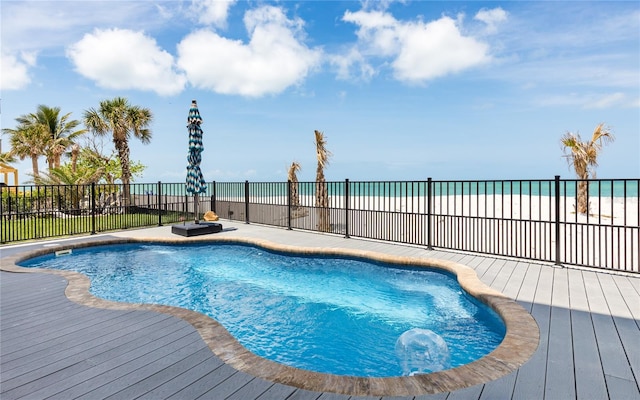 4620 Oro Pesos Ln, Captiva, FL 33924 - view of swimming pool with fence and a deck with water view