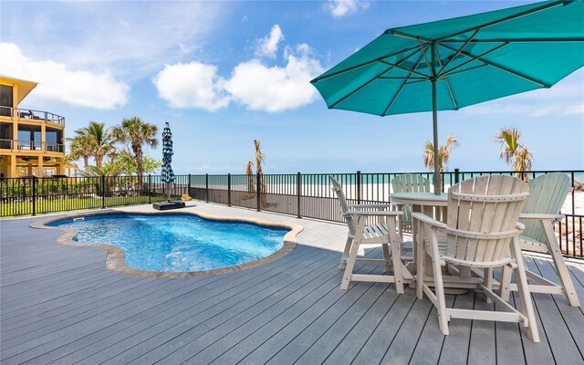 4620 Oro Pesos Ln, Captiva, FL 33924 - view of swimming pool with a deck with water view and fence