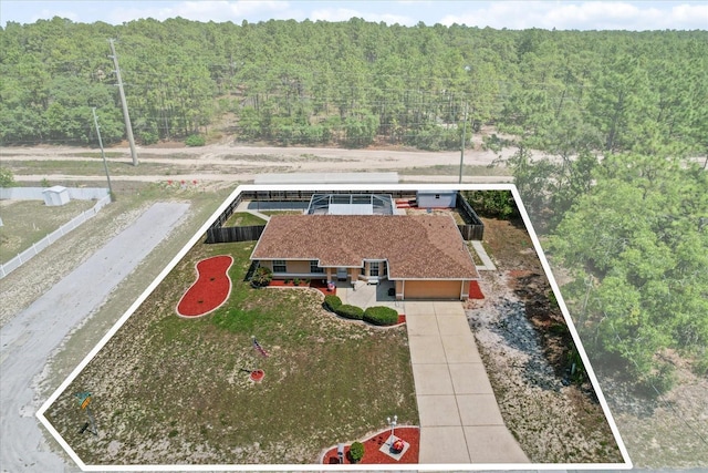 view from above of property with a forest and property parcel outlined