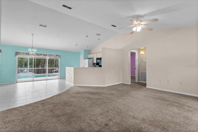 unfurnished living room featuring ceiling fan, lofted ceiling, carpet floors, baseboards, and tile patterned flooring
