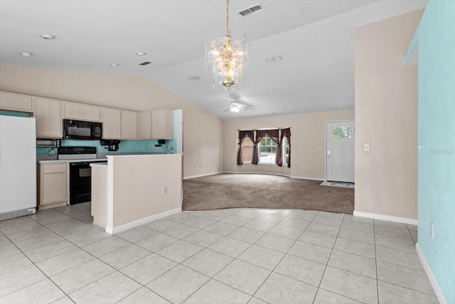 kitchen with freestanding refrigerator, range with electric stovetop, black microwave, vaulted ceiling, and a ceiling fan