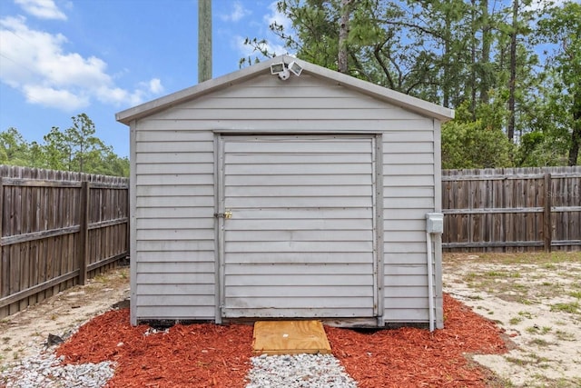 view of shed with a fenced backyard