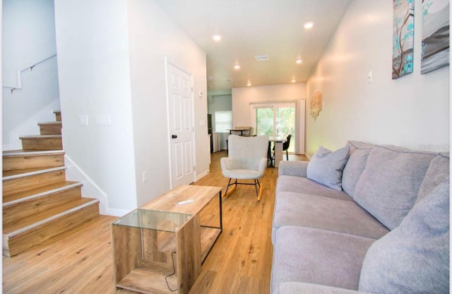 1933 Oxnard Ct, Tampa, FL 33612 - living area with stairs, light wood finished floors, recessed lighting, and baseboards