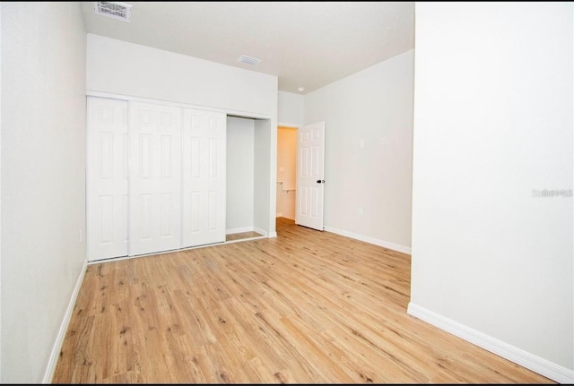 1933 Oxnard Ct, Tampa, FL 33612 - unfurnished bedroom featuring light wood-style flooring, baseboards, and a closet