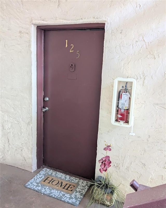 3840 N Lake Dr Unit 125, Tampa, FL 33614 - view of exterior entry featuring stucco siding