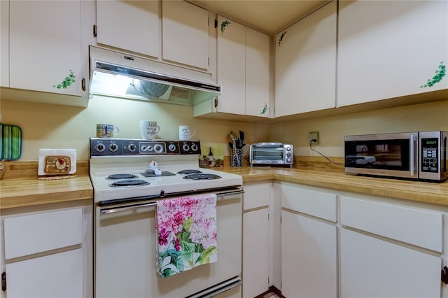 kitchen with white electric range oven, under cabinet range hood, stainless steel microwave, white cabinets, and butcher block countertops
