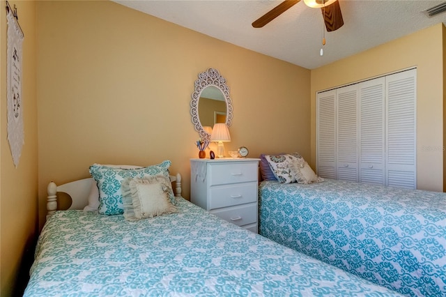 bedroom with a closet and a ceiling fan