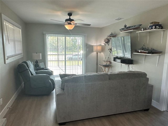 11729 John Robbins Rd, Riverview, FL 33578 - living room featuring wood finished floors, ceiling fan, and baseboards