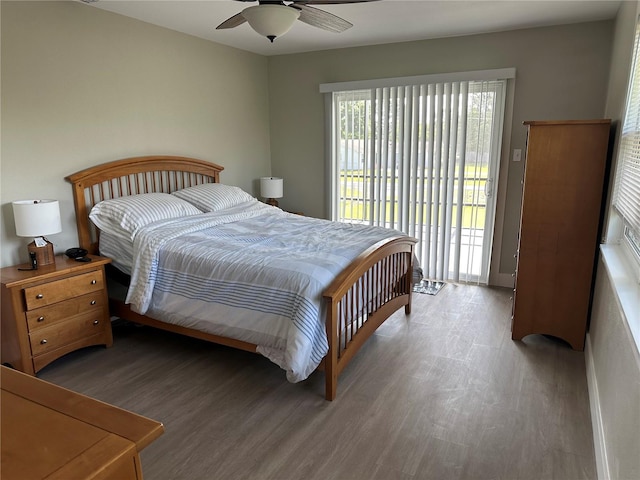 11729 John Robbins Rd, Riverview, FL 33578 - bedroom featuring access to outside, wood finished floors, and ceiling fan