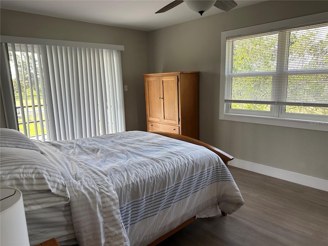 11729 John Robbins Rd, Riverview, FL 33578 - bedroom featuring baseboards, wood finished floors, and ceiling fan